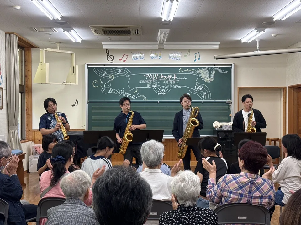Children and local residents join in. Their clapping brings even more joy to our playing.